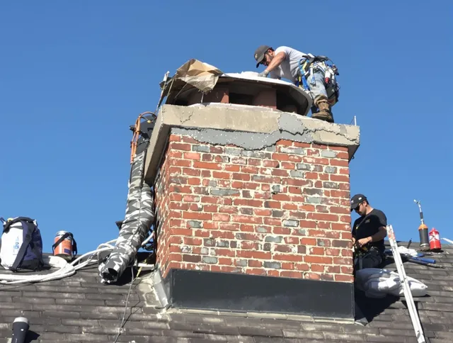 Simsbury Chimney Sweep installing a custom chimney crown in Simsbury, CT