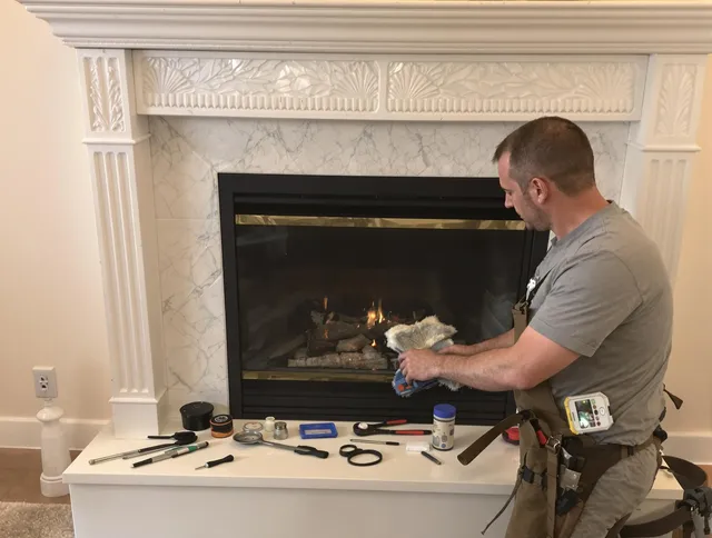 Simsbury Chimney Sweep performing fireplace maintenance in Simsbury, CT
