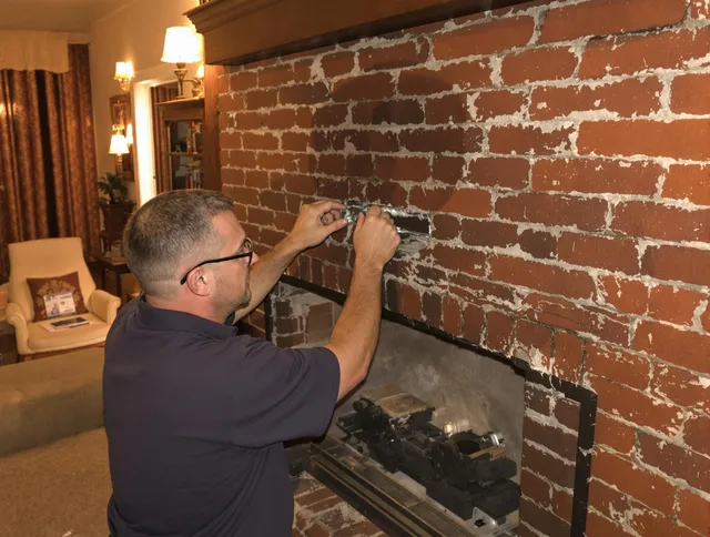 Simsbury Chimney Sweep expert fixing a fireplace in Simsbury, CT